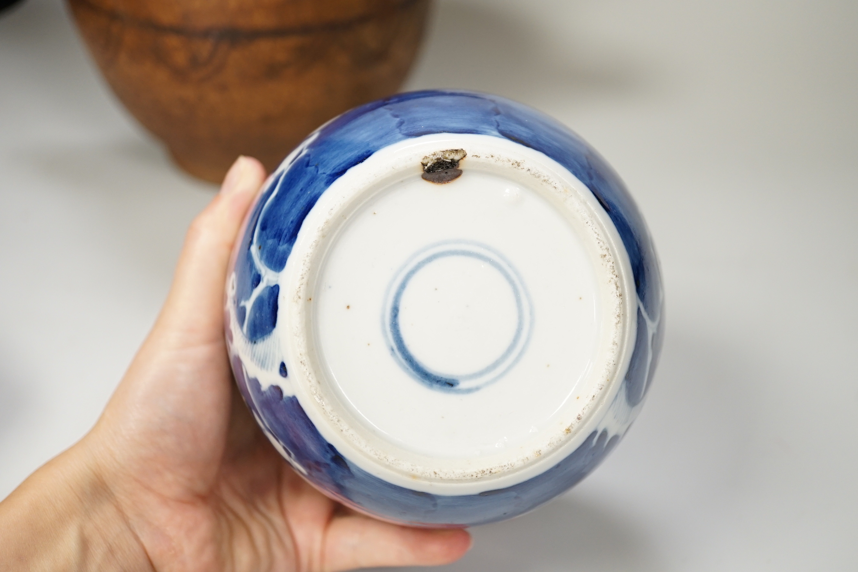 A Chinese blue and white prunus jar and cover, a Japanese Satsuma pottery bowl and a Moroccan terracotta jug, 20cm tall